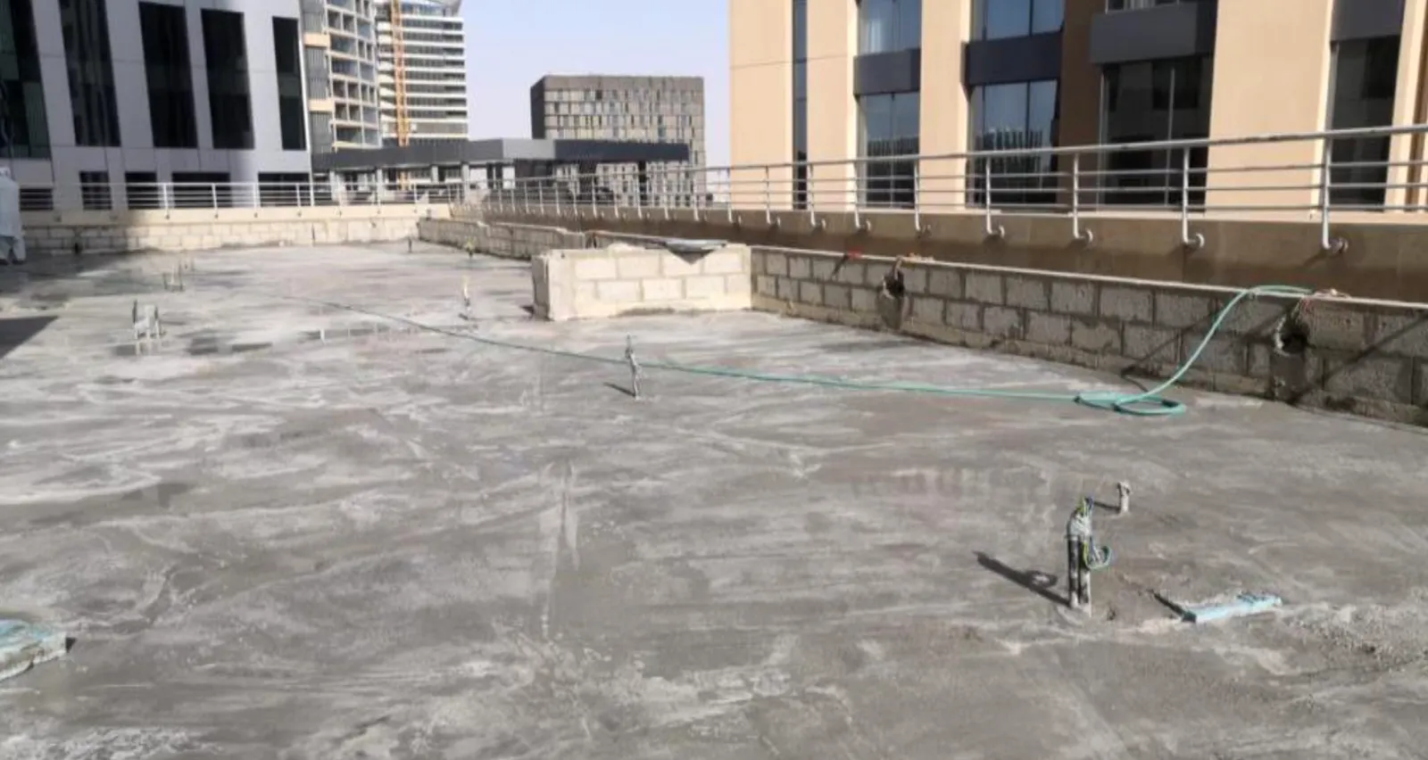 KAFD Tower Terrace Works — preparation: site and deck preparation before the build-up is laid
